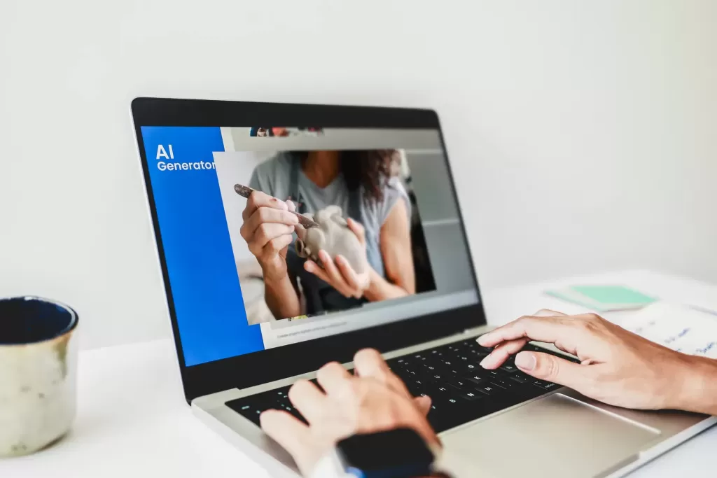 A person uses a laptop displaying a presentation slide titled "AI Generation," featuring a photo of hands sculpting clay.